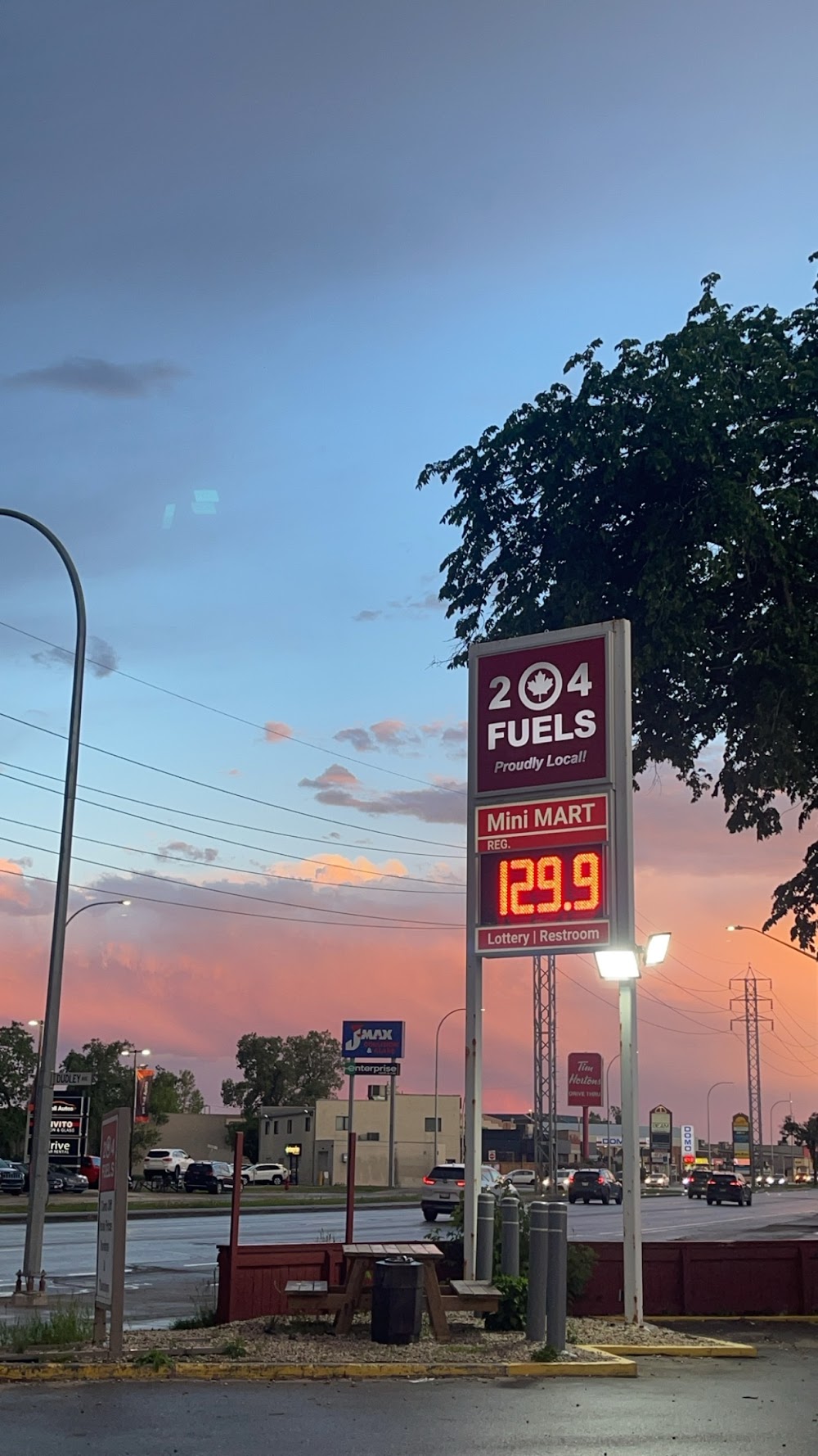 204 Fuels roadside sign and exterior view at sunset